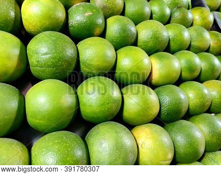 Sweet Lemon Arranged In Row For Sale In Fruits Juice Shop