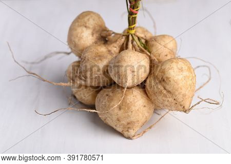Fresh Jicama Or Yam On White Background, Jicama Can Be Eaten Raw Or Cooked, The Taste Are Crisp, Jui