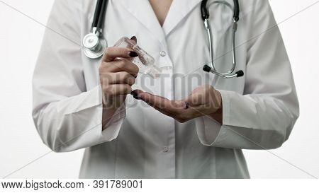 Close Up Female Doctor In Medical Uniform Wash Hands With Alcohol Antibacterial Sanitizer Gel, Rubs 