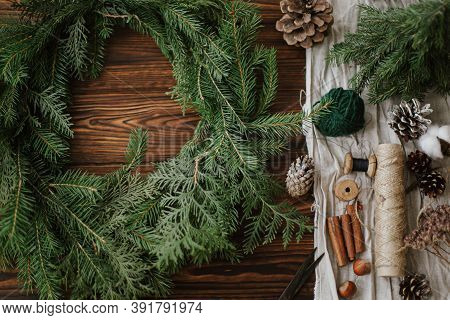 Christmas Wreath With Berries, Green Branches, Pine Cones And Natural Festive Decorations