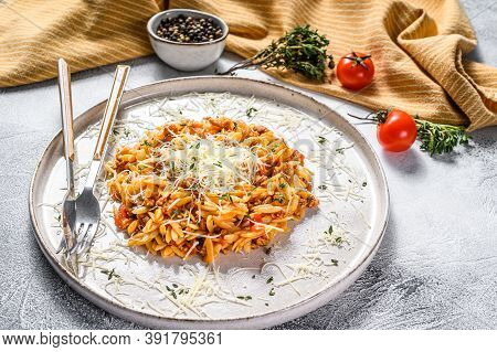 Orzo Pasta, Risone With Bolognese Sauce And Ground Beef In A Plate. Gray Background. Top View