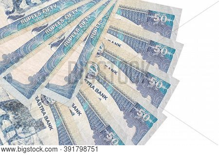 50 Nepalese Rupees Bills Lies Isolated On White Background With Copy Space Stacked In Fan Shape Clos