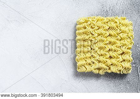 Dry, Raw Quick Cooking Noodle, Instant Noodles. White Background. Top View. Copy Space