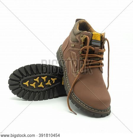 Men's Winter Youth Boots With Laces. Brown Leather, Metal Hardware, Thick Grooved Sole.  Isolated Ov