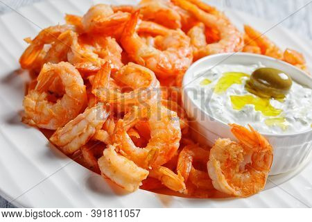 Seafood Plate Of Fried Garlic Prawns Or Shrimps Deshelled And Deveined Served With Greek Tzatziki Sa
