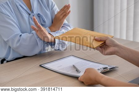 Government Officials Refused To Accept Bribes From The Businessmen Offer For Signing In A Contract O