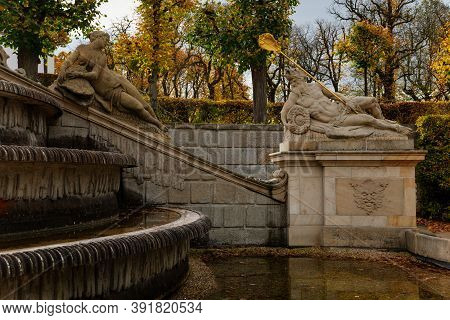 Rococo Chateau From The 18th Century, Baroque Statues Decorating The Garden Fountain In The Castle D