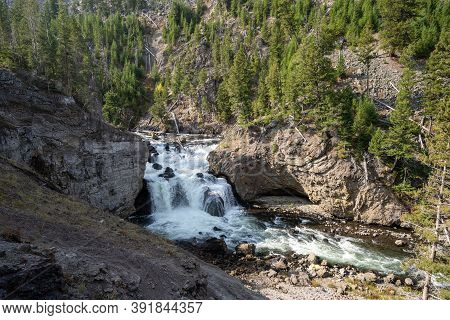 Firehole Falls, A Beautiful Waterfall Along Firehole Canyon Drive In Yellowstone National Park