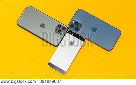 Paris, France - Oct 23, 2020: Overhead View Of Se, 11 Pro And New Iphone 12 Pro Max 5g Smartphone Mo