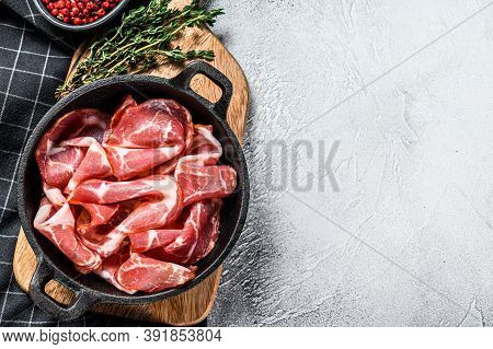Italian Rolled Bacon Pancetta Piacentina. Pork Meat. White Background. Top View. Copy Space