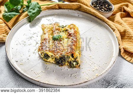 Cannelloni With Ricotta And Spinach. Italian Cuisine. Gray Background. Top View