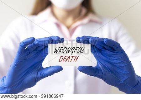 Wrongful Death Concept Inscription In Doctor Hand, Medical Working At Office.