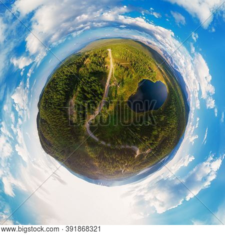 Little planet transformation of spherical panorama 360 degrees of the lake of Kidelyu near the Ulagan mountain pass, Altai Republic, Russia. Aerial drone view, virtual reality content.