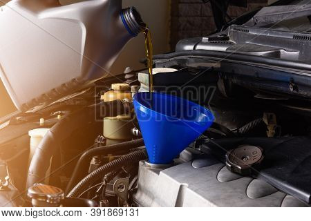 Hand Mechanic In Service To Repair A Car, Pouring Change Lubricant Oil At Maintenance Repair Service