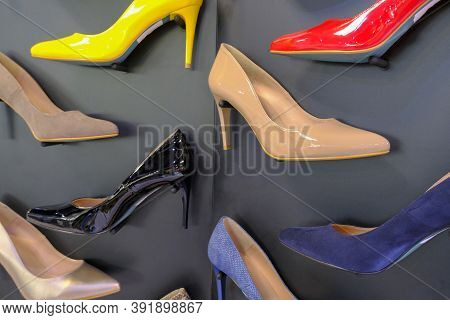 Red, Yellow, Black, Brown, Blue And Beige Shoes On Heels On Store Display Close-up. Fashion Stylish 