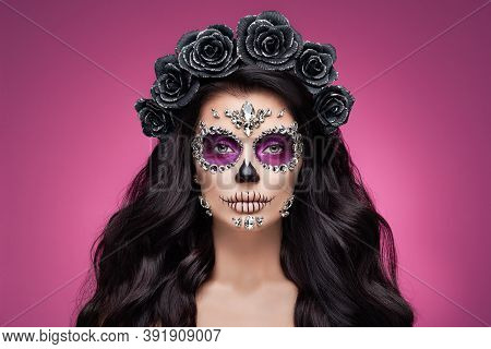 Portrait Of A Woman With Sugar Skull Makeup Over Red Background. Halloween Costume And Make-up. Port