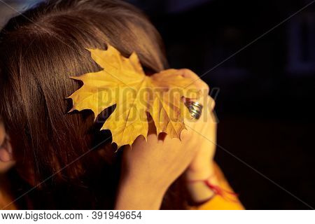Beautiful Caucasian Young Woman Walking And Having Fun Outdoors In Autumn Time. Bright Yeallow Color