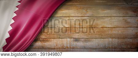 Qatar Flag On Vintage Wood Wall. Horizontal Panoramic Banner.