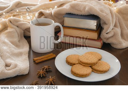Living Room Details In Winter. Close-up Of A White Mug With An Infusion On A Wooden Table With Anise