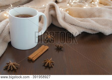 Living Room Details In Winter. Close-up Of A White Cup With An Infusion On A Wooden Table With Anise