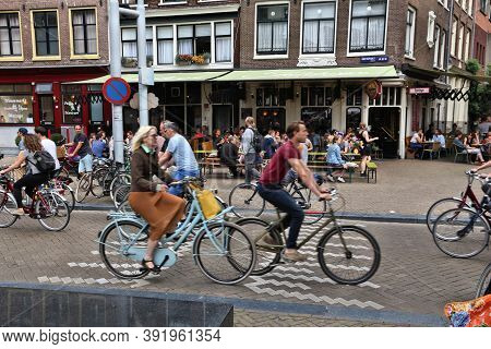 Amsterdam, Netherlands - July 8, 2017: People Visit Nieuwmarkt Square In Amsterdam, Netherlands. Ams