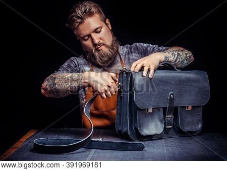 Professional Leather Worker Works With Leather At Studio