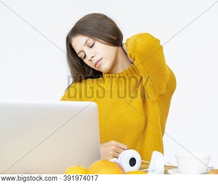 Woman Massaging Neck Pain From Working At Computer For Long Time
