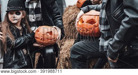 Scary Family,mother,father,daughters Celebrating Halloween.pumpkins Jack-o-lantern.terrifying Black 
