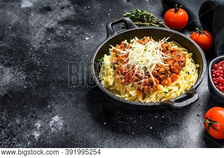 Orzo Pasta, Risone With Bolognese Sauce And Ground Beef. Black Background. Top View. Copy Space