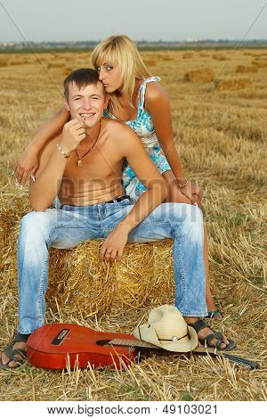 A Pair Of Lovers In The Hay With Guitar