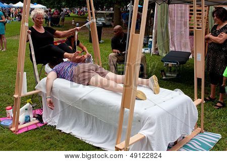 Woman Gets Ashiatsu Barefoot Massage At Summer Festival