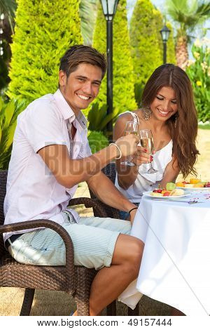 Laughing Couple Drinking Champagne