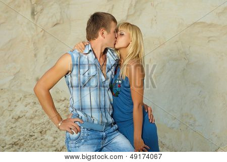 Guy And  Girl In  White Sand