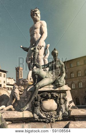 The fountain of Neptune by Bartolomeo Ammannati, in the Piazza della Signoria, Florence, Italy.  The look and texture of an old vintage postcard.