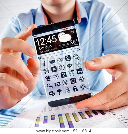Smart phone (phablet) with a transparent display in human hands. Concept actual future innovative ideas and best technologies humanity.