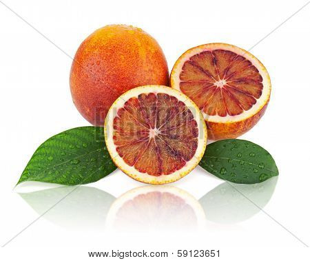 Blood Oranges With Cut And Green Leaves Isolated On White Background.