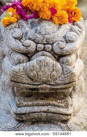 Chinese Lion angry statue at Wat Suthat Bangkok Thailand