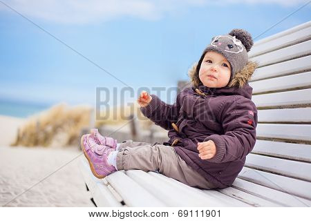 toddler sitting colder times in the norhsea