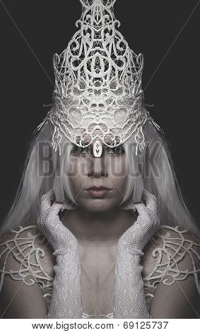 Queen of Winter woman wearing crown and white lace