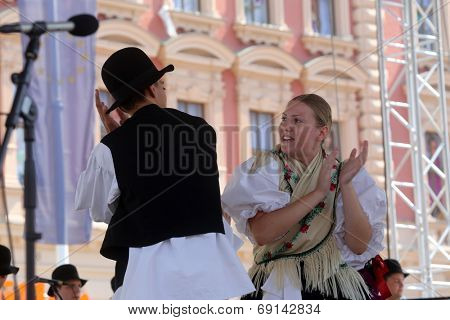 ZAGREB, CROATIA - JULY 19: Members of folk group Seljacka sloga from Donja Dubrava, Croatia during the 48th International Folklore Festival in center of Zagreb, Croatia on July 19, 2014