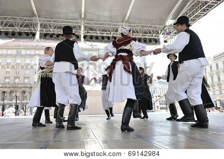 ZAGREB, CROATIA - JULY 19: Members of folk group Seljacka sloga from Donja Dubrava, Croatia during the 48th International Folklore Festival in center of Zagreb, Croatia on July 19, 2014