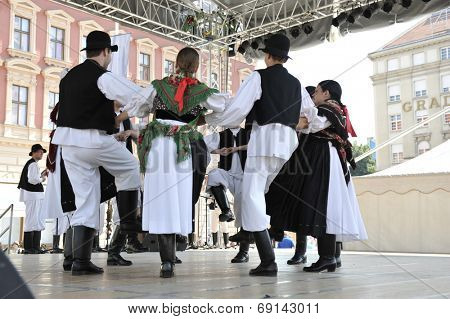 ZAGREB, CROATIA - JULY 19: Members of folk group Seljacka sloga from Donja Dubrava, Croatia during the 48th International Folklore Festival in center of Zagreb, Croatia on July 19, 2014