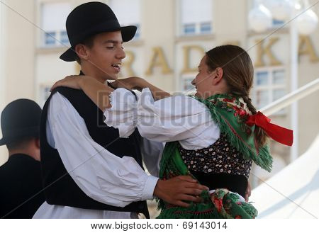 ZAGREB, CROATIA - JULY 19: Members of folk group Seljacka sloga from Donja Dubrava, Croatia during the 48th International Folklore Festival in center of Zagreb, Croatia on July 19, 2014
