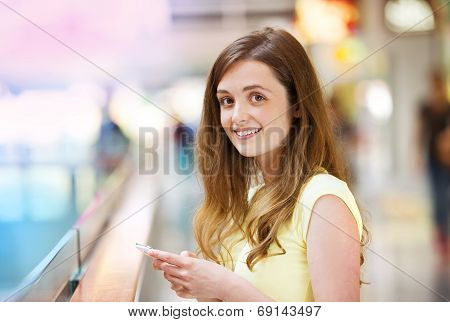 Shopping girl with smartphone