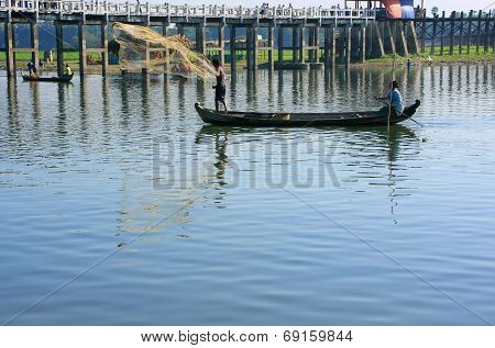 AMARAPURA, MYANMAR - DECEMBER 31: An unidentified man fishes in a lake on December 31, 2011 in Amara