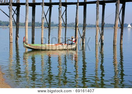 AMARAPURA, MYANMAR - DECEMBER 31: An unidentified man fishes in a lake on December 31, 2011 in Amara