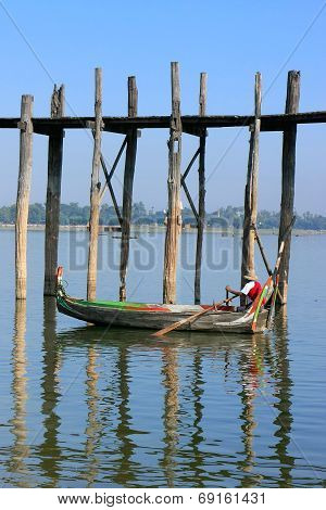 AMARAPURA, MYANMAR - DECEMBER 31: An unidentified man fishes in a lake on December 31, 2011 in Amara