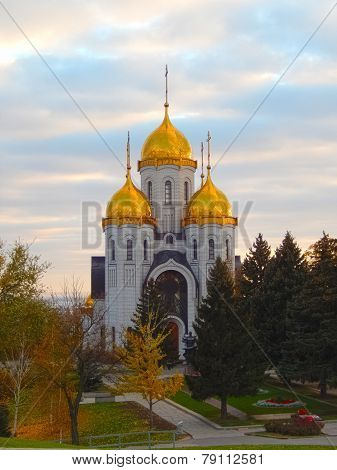Church in the autumn park on a cloudy, overcast