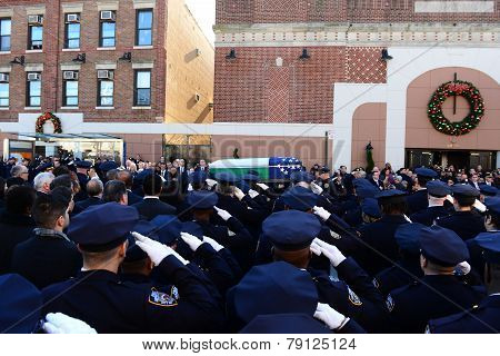 Salute as flag-draped coffin passes