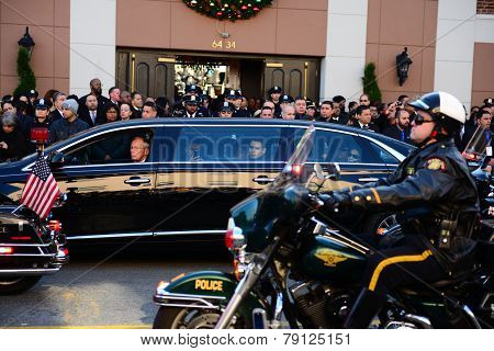 Motor police procession past limosine